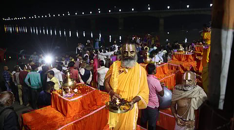 Priest offering puja at Saryu river at Ayodhya on the Day of Ayodhya land dispute judgement. | (Photo | Shekhar Yadav/EPS)