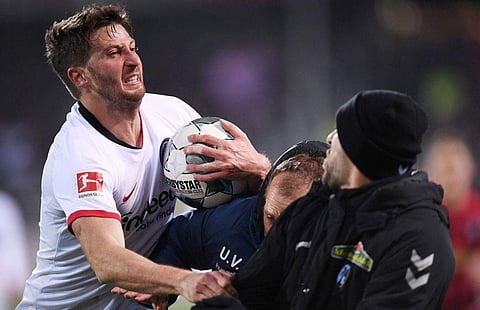 Upset Freiberg players and staff then chased David Abraham on the field. (Twitter Photo)