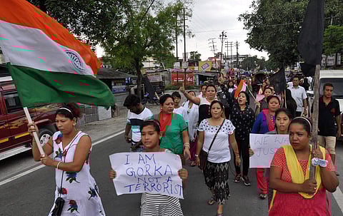 Supporters of GJM raise slogans in a rally to demand for separate State of 'Gorkhaland' in Siliguri. (Photo| PTI)