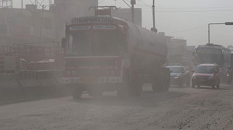 A truck passing through a busy stretch near Vanagaram, Chennai. 