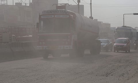 A truck passing through a busy stretch near Vanagaram when air pollution was at its peak in Chennai. (Photo | Martin Louis, EPS)