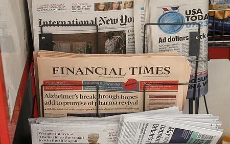 Copies of the Financial Times newspaper sit in a rack at a newsstand in London, Britain July 23, 2015. (Photo | Reuters)