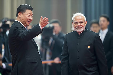 File photo of Chinese President Xi Jinping, left, welcoming Indian Prime Minister Narendra Modi for a meeting at the Shanghai Cooperation Organization (SCO) Summit. (File | AP)