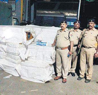 The RPF team with the seized cigarette boxes at Krantiveera Sangolli Rayanna Railway Station| Express