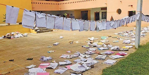 Books are put out to dry at Shree Sharadamba Vidyaniketan School| Express