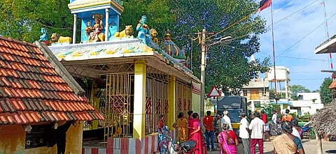 Locals gather at the Mariamman temple from where the idol of the main deity was stolen on Friday morning. (Photo | Express)