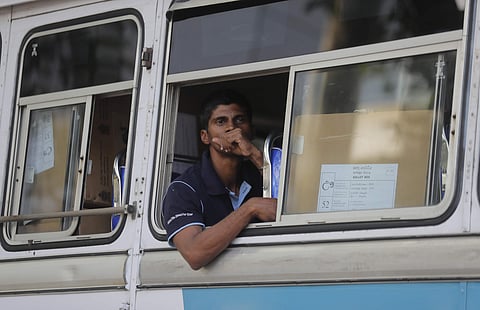 A Sri Lankan polling worker sits in a bus transporting polling material, outside a material distribution center in Colombo, Sri Lanka, Friday, Nov. 15, 2019. (Photo | AP)