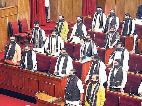 BJP MLAs cover their mouth with black cloth as a part of their silent protest against State Government during Assembly session in Bhubaneswar on Friday| Express
