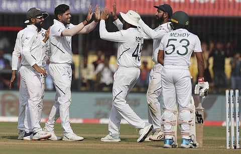 India's Umesh Yadav, second left, celebrates with teammates the dismissal of Bangladesh's Mehidy Hasan, right, during the third day of first cricket test match between India and Bangladesh in Indore, India, Saturday, Nov. 16, 2019. (Photo | AP)