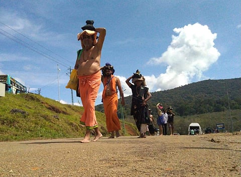 Sabarimala Pilgrims at Nilakkal base camp on Saturday before proceeding to Pamba to trek Sabarimala for offering prayers when the temple opens. (Photo | A Sanesh, EPS)