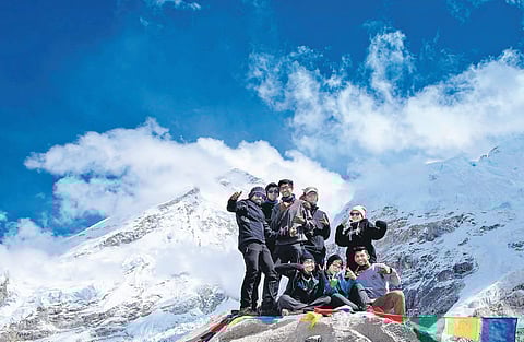 The students rejoice after reaching the Everest Base Camp,  which is located 5,365 metres above sea level