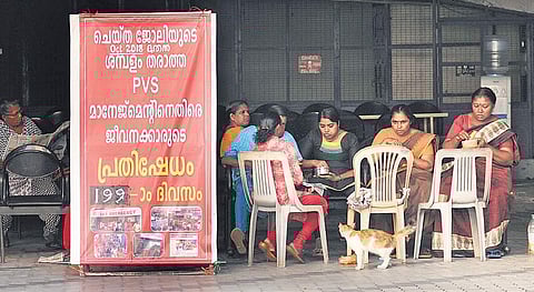 Employees protesting in front of PVS Hospital at Kaloor on Friday | A Sanesh