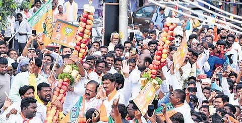 A day after joining the BJP, rebel MLA Ramesh Jarkiholi was welcomed with a garland of apples weighing two quintals, in Gokak on Friday | Express
