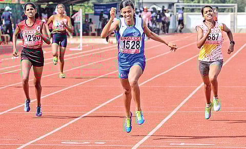 Prathibha Varghese of GGHSS Balussery, Kozhikode, winning gold in junior girls 400m in the Kerala State School Athletic Championship