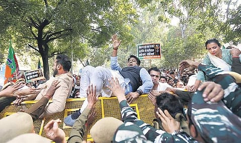 BJP workers erupt in protest near the AAP office on Saturday. (Photo | Arun Kumar, EPS)