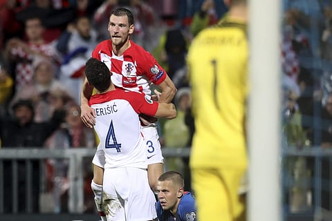 Croatia's Ivan Perisic, (4) celebrates with Nikola Vlasic after scoring his side's third goal during the Euro qualifying match against Slovakia. (Photo | AP)