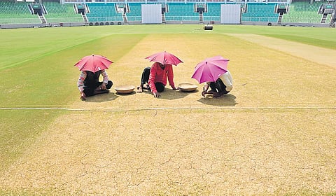 Workers giving finishing touches to the pitch at Greenfield stadium at Kariyavattom, Thiruvananthapuram | file photo