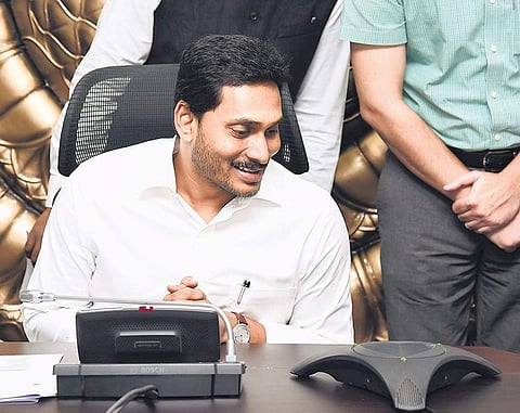 Chief Minister YS Jagan Mohan Reddy launches Andhra Pradesh State Agriculture Mission website at his camp office in Tadepalli on Monday| Express