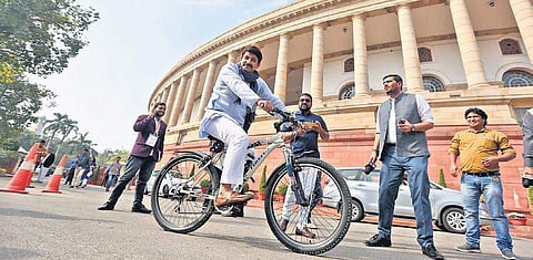 BJP MP Manoj Tiwari arrives in Parliament on a bicycle on the first day of Winter session. (Photo | Shekhar Yadav, EPS)
