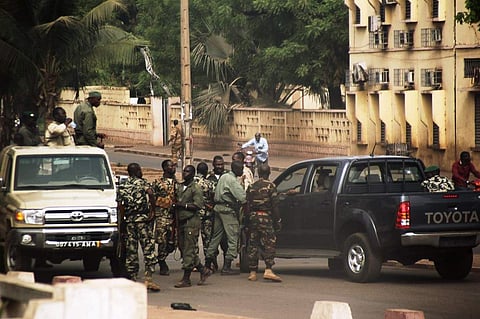 Malian soldiers gather on a street of Bamako (File photo| AFP)
