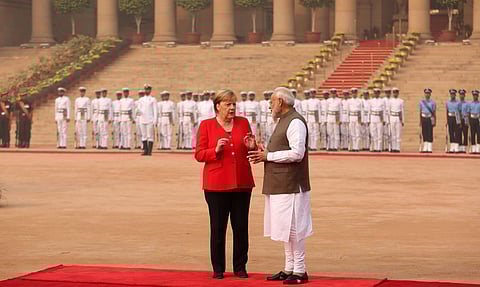 Prime Minister Narendra Modi interacts with German Chancellor Angela Merkel during her ceremonial reception at Rashtrapati Bhawan in New Delhi. (Photo | Shekhar Yadav, EPS)