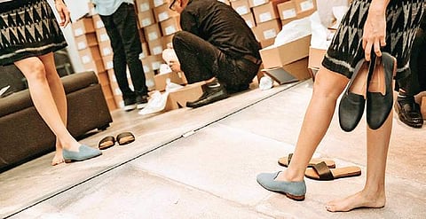 Visitors trying JVAM shoes at DLF Emporio Mall in Delhi