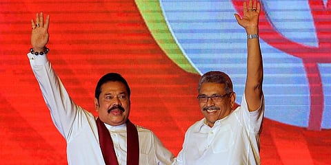 Sri Lankan President Gotabaya Rajapaksa (R) with his elder brother Mahinda Rajapaksa. (Photo | AP)