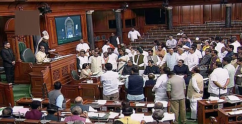 Opposition members protest in the Lok Sabha during the Winter Session of Parliament. (File | PTI))