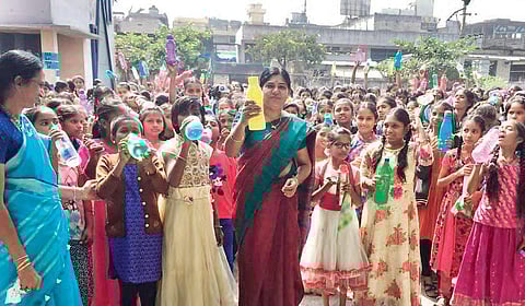 Students and staff of a school in Mancherial district during a break following the ringing of the ‘water bell’  a school in Mancherial district during a break following the ringing of the ‘water bell’