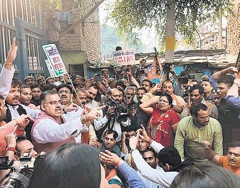 BJP workers protest the ‘poor’ water supply outside the Delhi Jal Board office in New Delhi on Saturday. (Photo | Twitter')