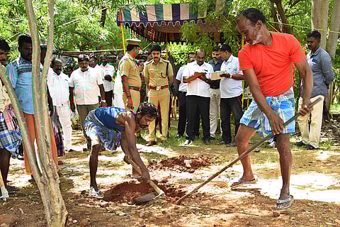 In this picture, the remains of a women killed in 2013 is being exhumed.