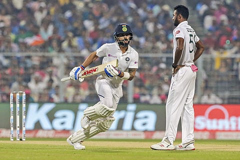 India's captain Virat Kohli takes a run as Bangladesh's bowler Ebadot Hossain, right, looks on. (Photo | AP)