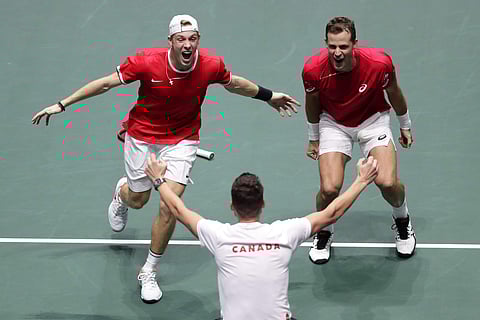 Canada's Vasek Pospisil (R) and Denis Shapovalov celebrate after winning against Australia's John Peers and Jordan Thompson during their Davis Cup double tennis match in Madrid. (Photo | AP)