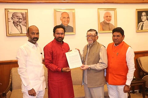 BJP MPs Bandi Sanjay Kumar and G Kishan Reddy speak with Union Minister of State for Labour Santhosh Kumar Gangawar in Delhi (Photo| Twitter/ @bandisanjay_bjp)