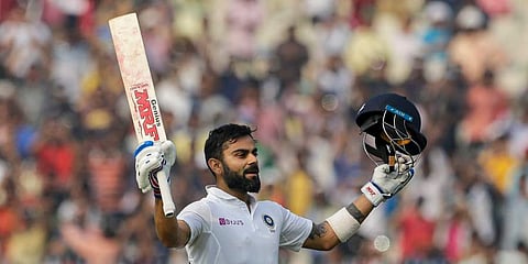 India's Virat Kohli celebrates scoring hundred runs during the second day of the second Test cricket match between India and Bangladesh, in Kolkata. (Photo | AP)