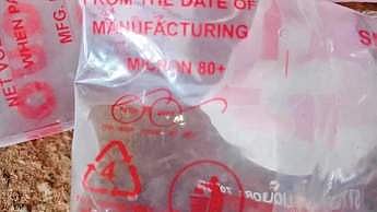 Gandhiji's glasses on country liquor pouches