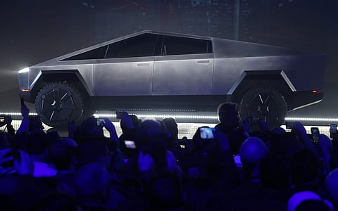 The industrial-looking Cybertruck is covered in the same steel alloy Musk plans to use for his SpaceX Starship rocket.(Photo | AP)