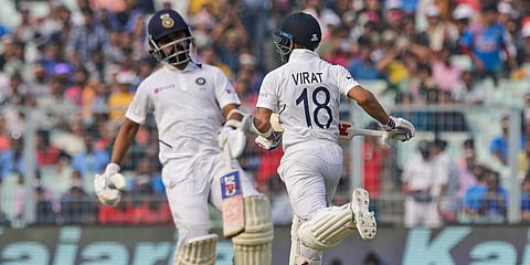 Virat Kohli and Ajinkya Rahane run between the wickets during the second day of the second Test cricket match between India and Bangladesh. (Photo | AP)