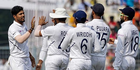 India's Virat Kohli, right, and other teammates congratulate Umesh Yadav for dismissal of Bangladesh's Ebadot Hossain during the third day of the second test cricket match between India and Bangladesh. (Photo | AP)