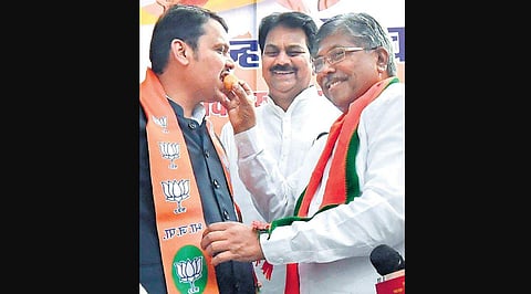 Newly sworn-in Maharashtra CM Devendra Fadnavis being offered sweets by supporters on his arrival at state BJP office in Mumbai on Saturday. (Photo | PTI)