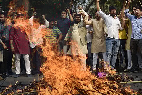 Youth Congress IYC members stage a protest against the BJP Government. (Photo| PTI)