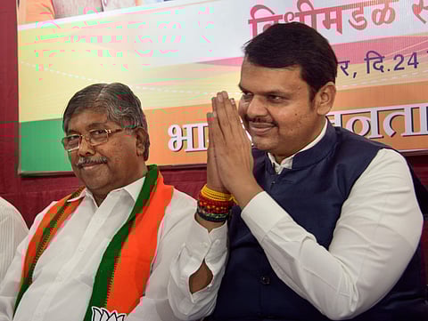 Maharashtra Chief Minister Devendra Fadanvis (R) and BJP state president Chandrakant Patil during party MLAs meeting at Vasant Smruti, Mumbai, Sunday Nov.24 2019. (Photo | PTI)