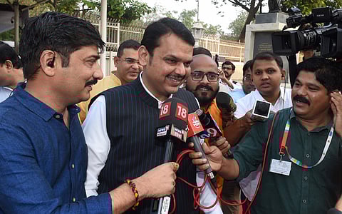Former Maharashtra chief minister Devendra Fadnavis talks with media on his arrival at Maharashtra Vidhan Bhawan in Mumbai Wednesday Nov. 27 2019. (Photo | PTI)