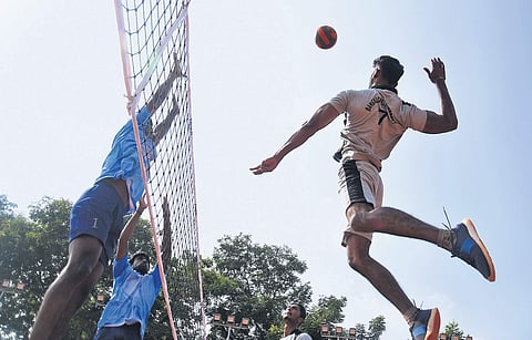 Players in action during South Zone inter-university volleyball tournament at SRR & CVR Government Degree College in Vijayawada on Tuesday. (Photo | P Ravindra Babu, EPS)