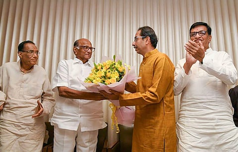 Shiv Sena President Uddhav Thackeray being greeted by NCP chief Sharad Pawar after he was chosen as the nominee for Maharashtra chief minister's post by Shiv Sena-NCP-Congress alliance during a meeting in Mumbai Tuesday Nov. 26 2019. (Photo | PTI)