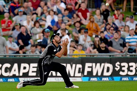 New Zealand's Daryl Mitchell takes the catch of England's captain Eoin Morgan during the Twenty20 cricket match between New Zealand and England at McLean Park in Napier. (Photo | AFP)