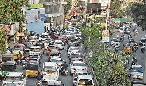 Visual of a traffic block at Punjagutta on Wednesday; (right) a pit dug by the GHMC at Punjagutta graveyard for soil testing | RVK Rao