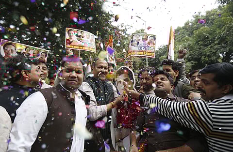 Congress supporters celebrate formation of the coalition government (Photo | Arun Kumar, EPS)