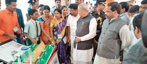 Governor Biswabhusan Harichandan admiring the science projects showcased by schoolchildren at Dr BR Ambedkar University in Srikakulam on Thursday | express