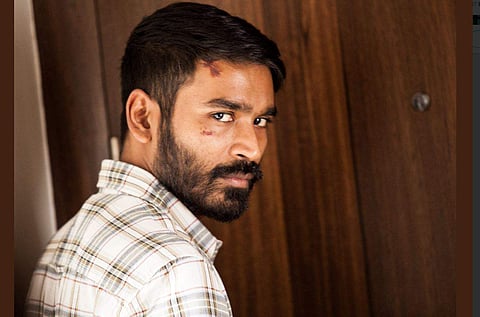 Lead actor Dhanush in 'Enai Noki Paayum Thota'. (Photo | Twitter)